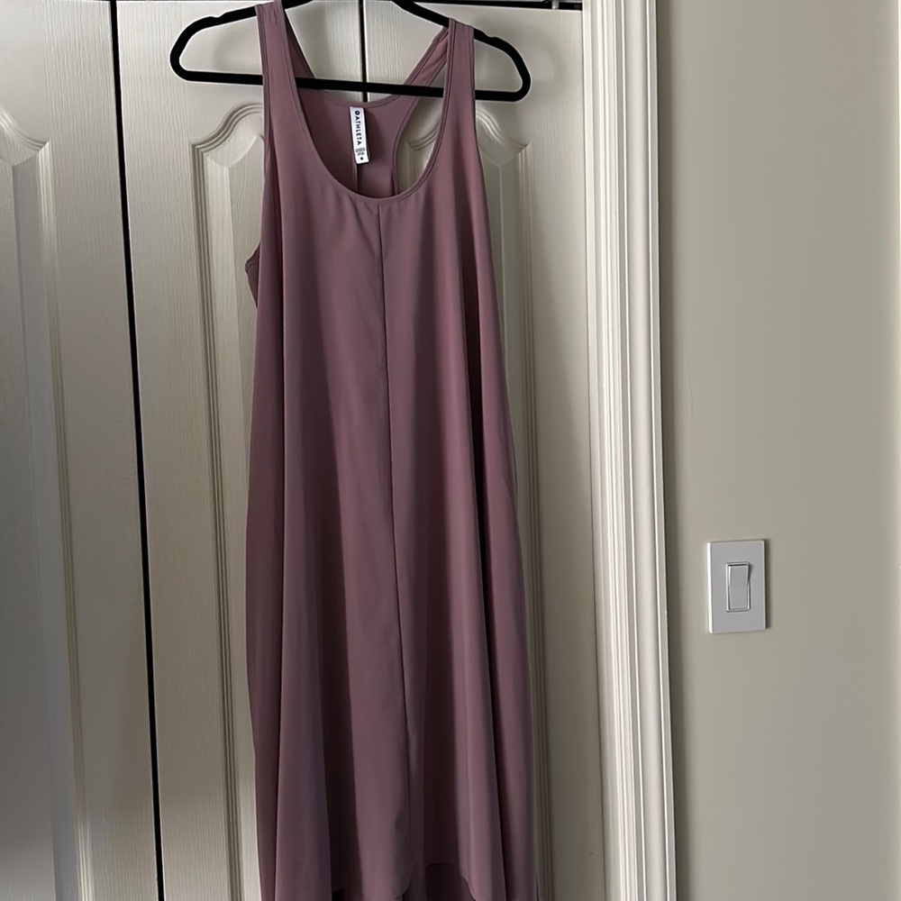 New without tags. Size Medium Bought for daughter but too long.